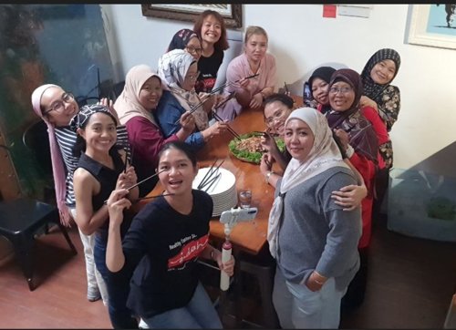 TeamIndah and friends sharing a meal together